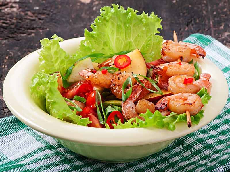 Shrimp salad with peaches and avocado