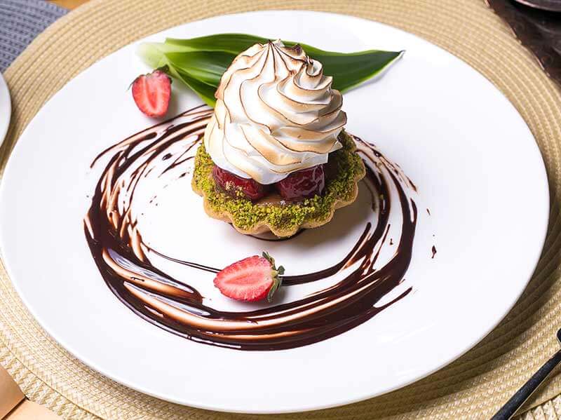 Tartlet with cherries and whipped cream