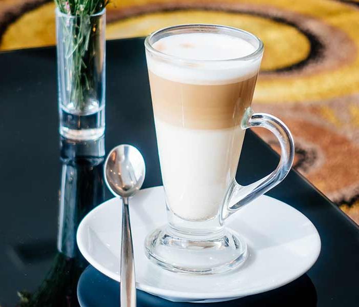 Coffee latte with milk and milk foam