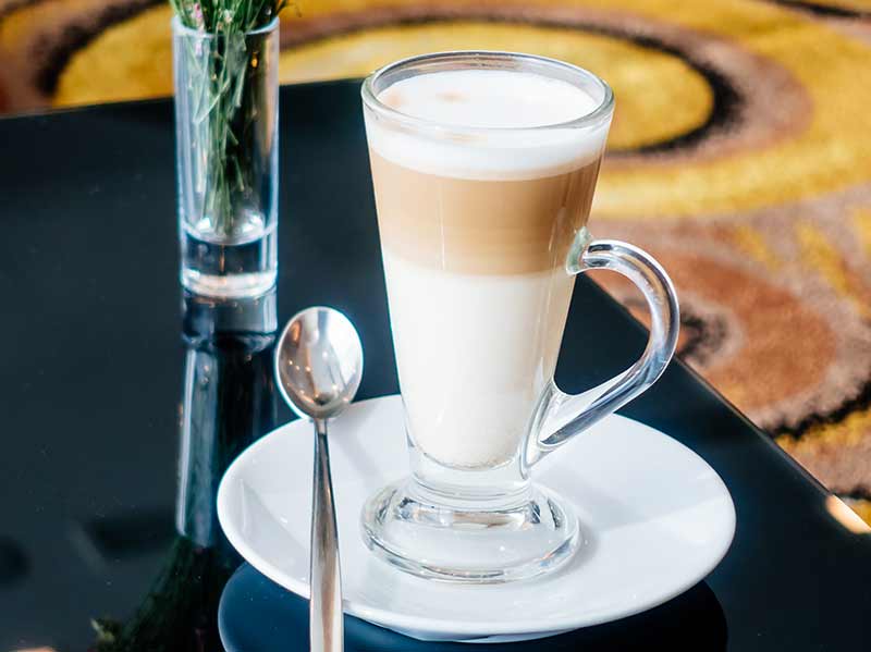 Coffee latte with milk and milk foam