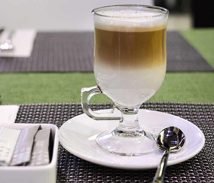 Frothy coffee with whipped milk cap