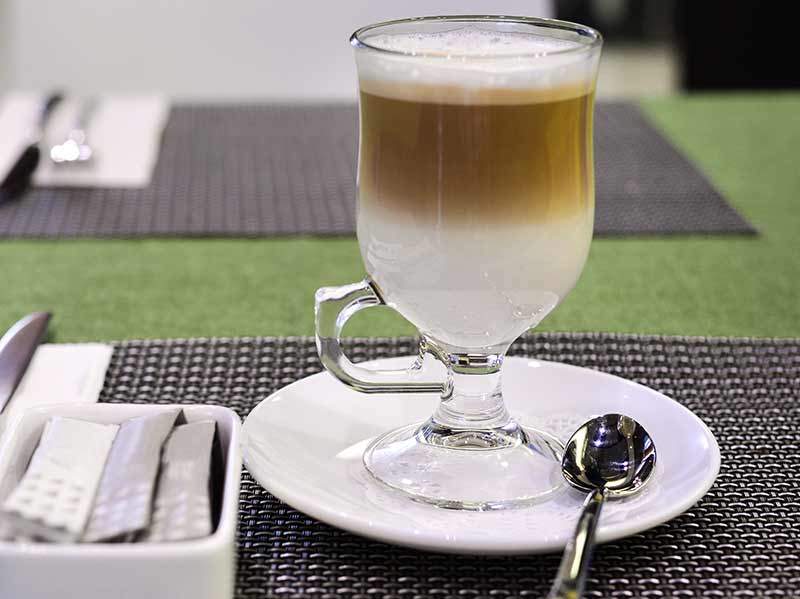 Frothy coffee with whipped milk cap